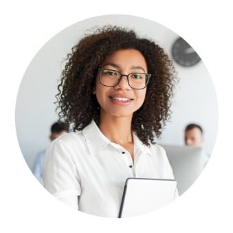 Smiling woman with tablet in office.